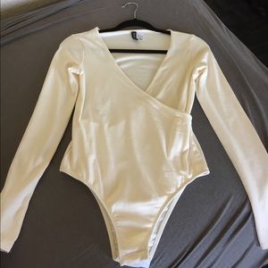 Cream H&M long sleeve bodysuit.