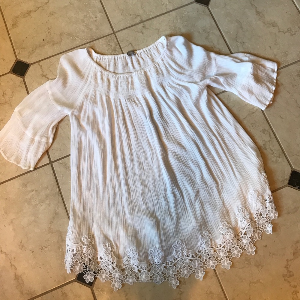 Three-quarter length bell sleeved top