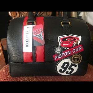 Black and red lightning McQueen piston cup purse.