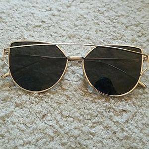 Gold and black sunglasses