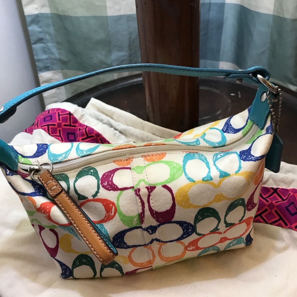 Cute small Tote  Coach ! clean used a few times.