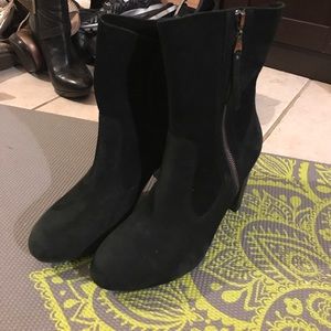Black heeled UGG boot side zipper