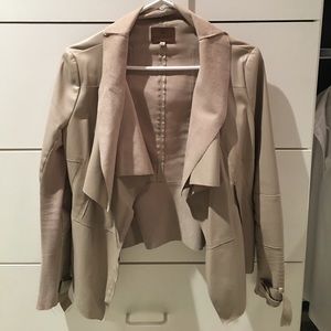 Tan draped leather and fabric jacket.
