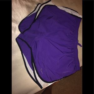 Purple Nike running shorts
