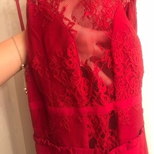 Red backless dress with slit. BEBE SIZE SMALL