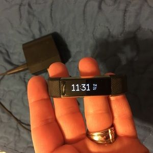 Fitbit Alta with charger.
