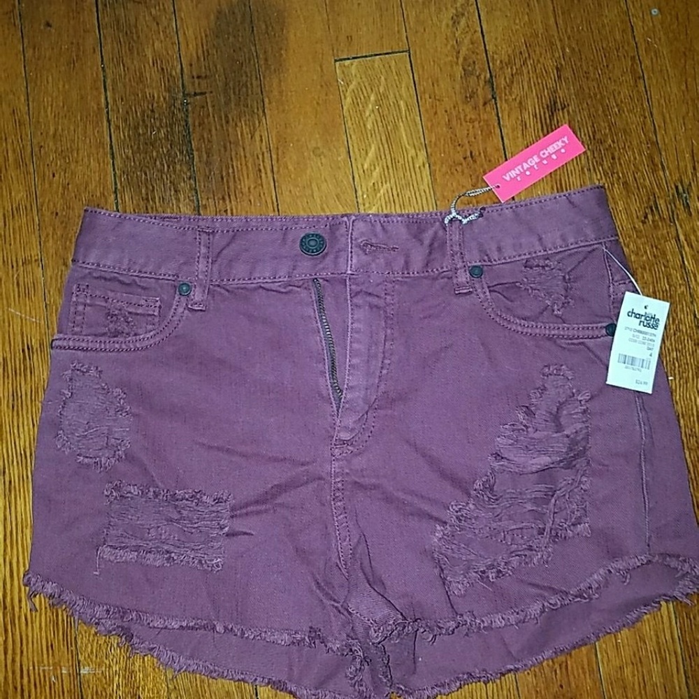 Purple High waisted distress shorts
