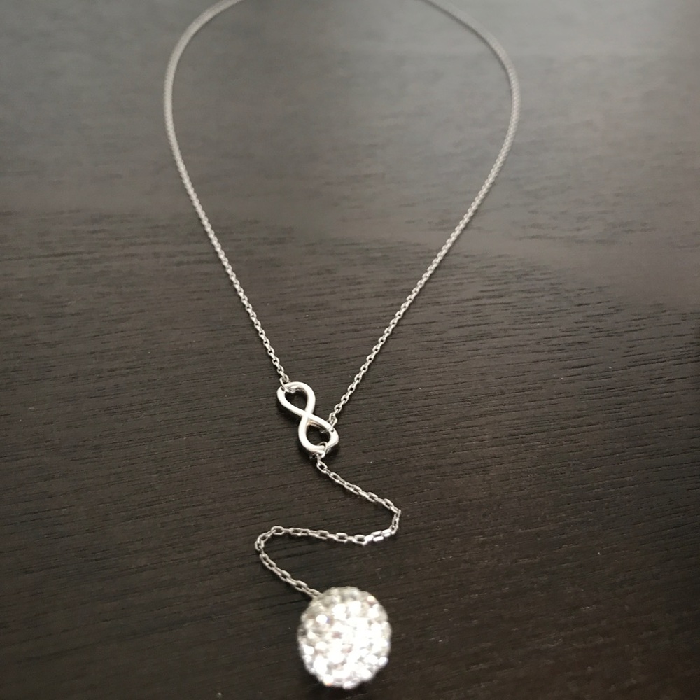 Necklace with infinity symbol.