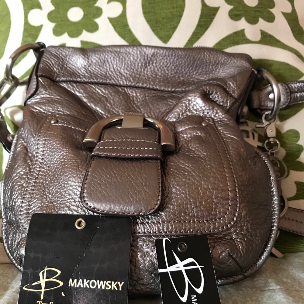 Makowsky pewter color purse and pewter hardware.