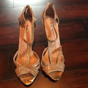 Gold glittered sparkly high heel shoes
