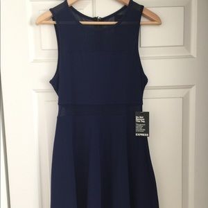 Express blue knee length dress with sheer detail.