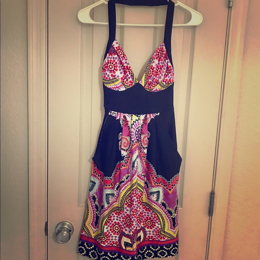 Multi-colored halter dress with pockets.