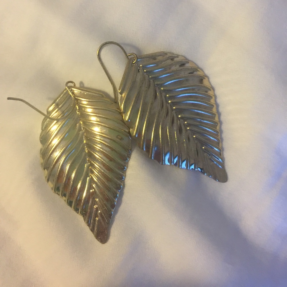 Never worn gold feather earrings