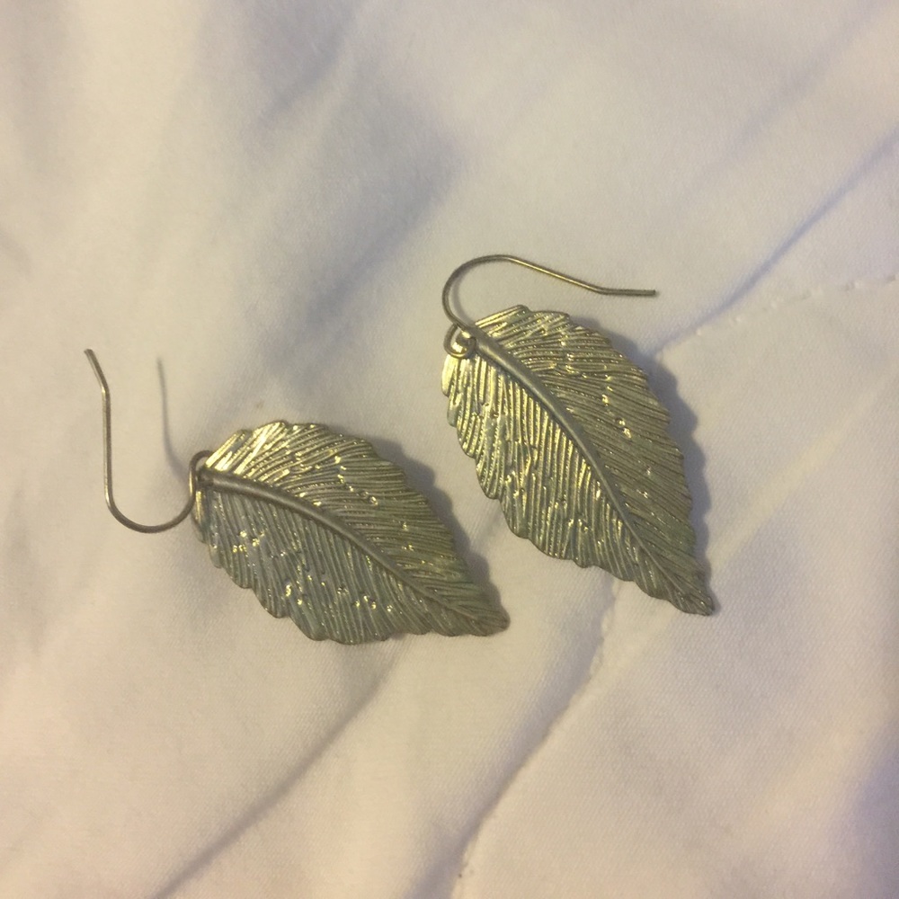 Never worn mini gold feather earrings