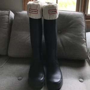 Tall black hunter boots