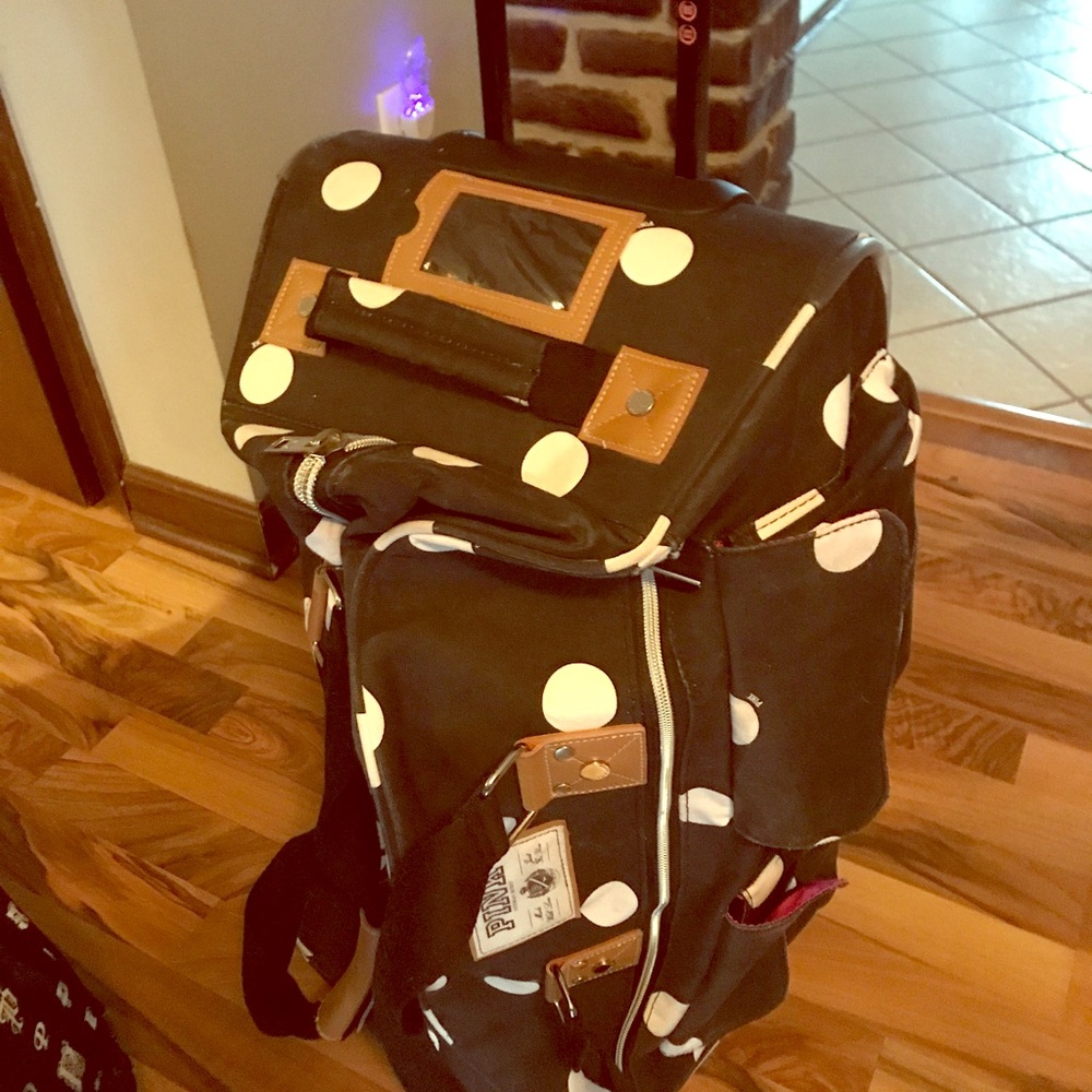Pink suitcase on wheels luggage