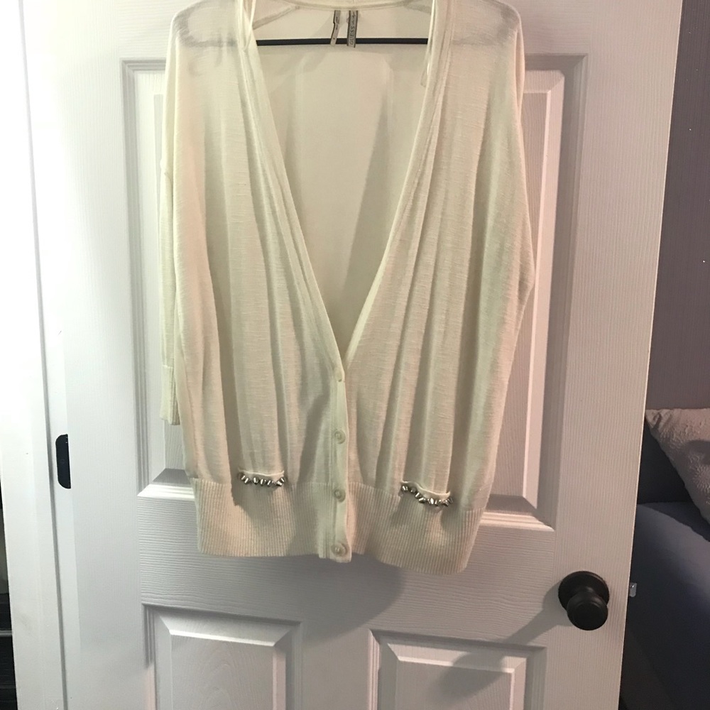 Nude sheer cardigan with an edge.