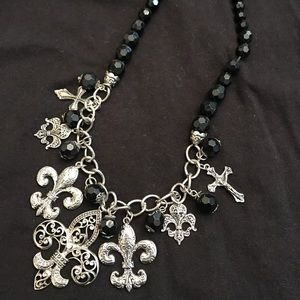 Black and silver necklace with fleur de lis