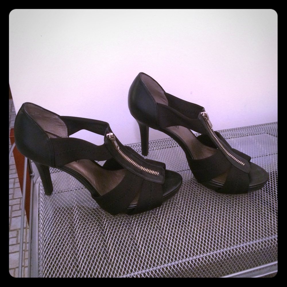 Black heels with zipper detail.