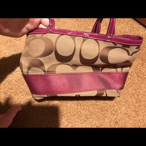 Small Coach raspberry and brown purse