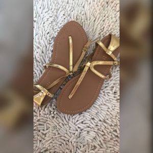 Gold colored sandals size 6.