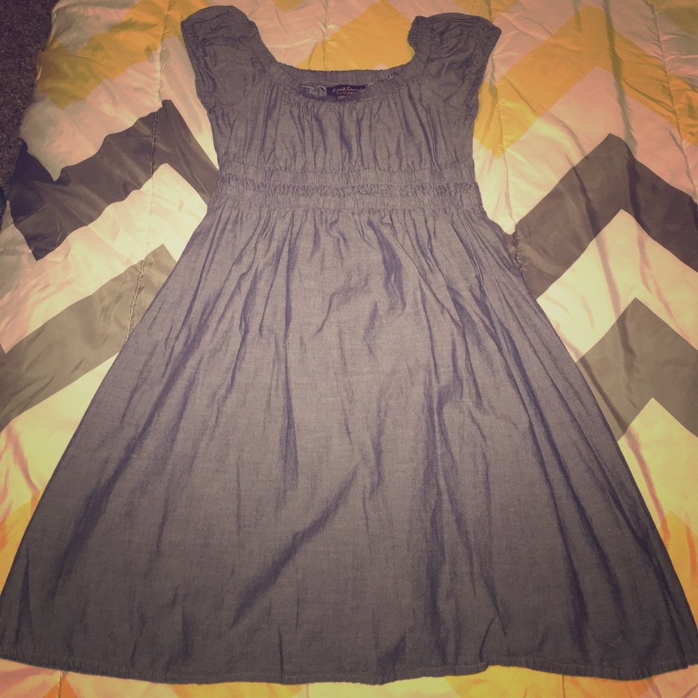 Blue jean dress with a red stain on the back