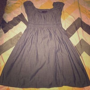 Blue jean dress with a red stain on the back