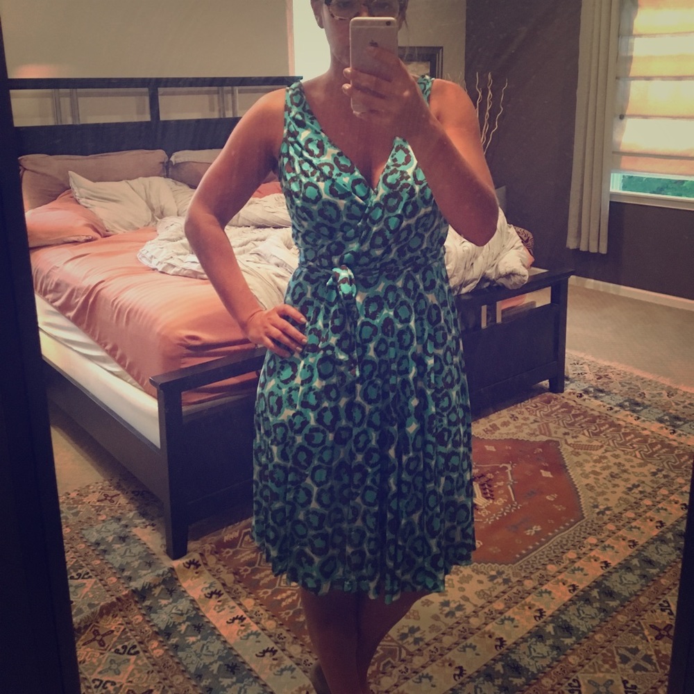 Sleeveless, wrap dress.