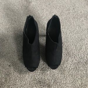 Black high heels with peep toe