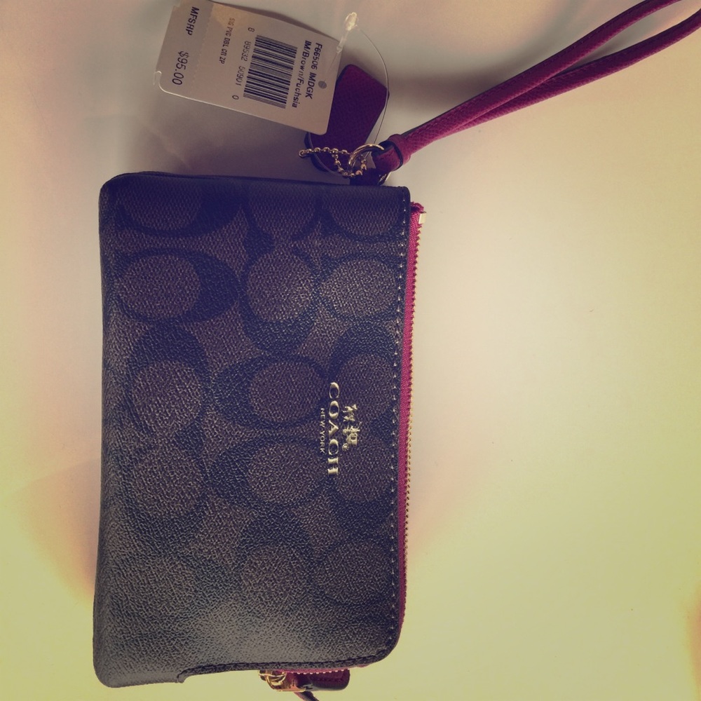 Brown and pink coach wristlet never used