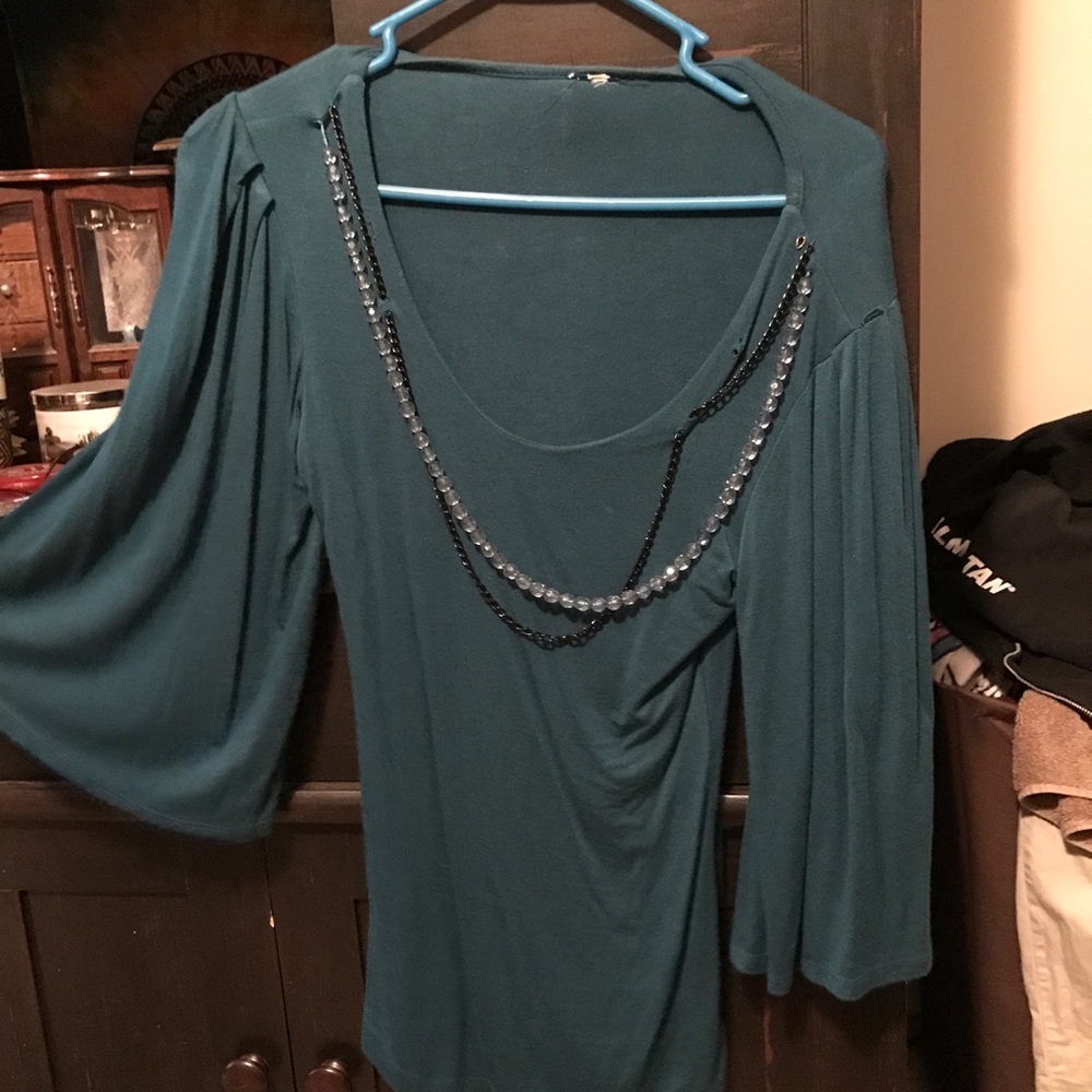 Turquoise blouse with bell sleeves