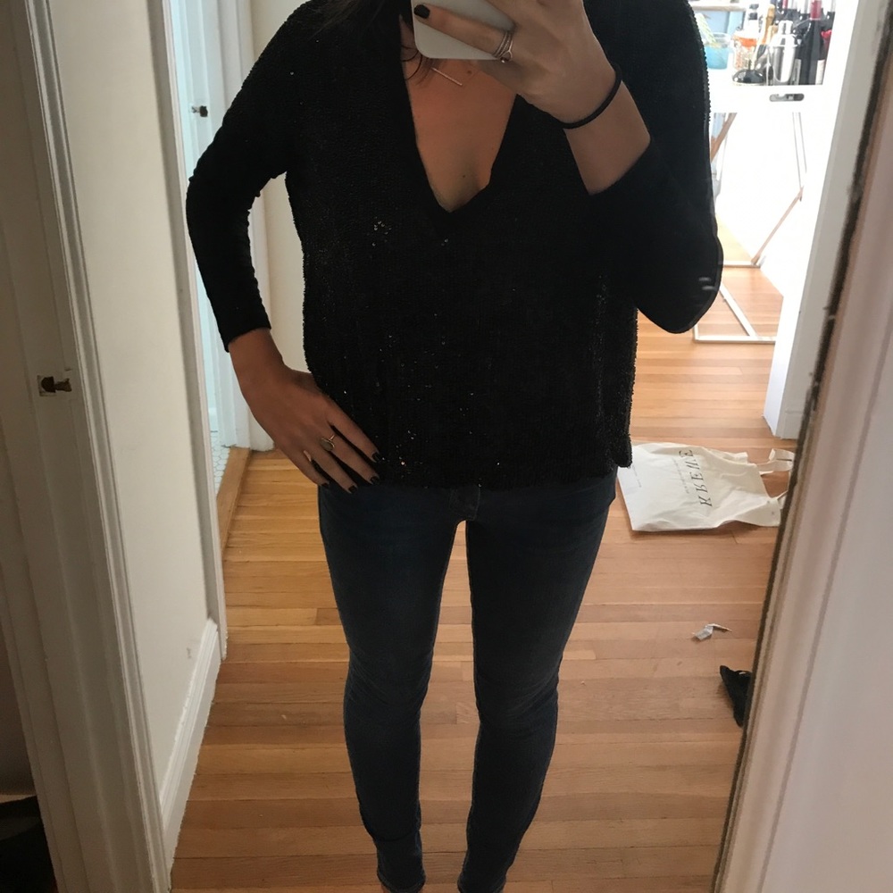 Sequin top with jersey trims. Perfect for holiday