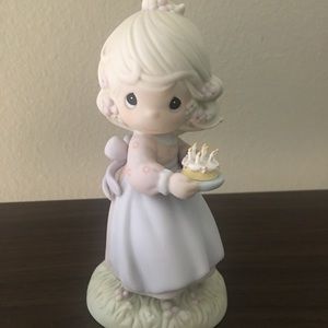 The Precious Moments ceramic figurine
