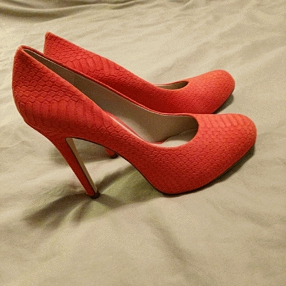Heels. Worn a handful of times. Small nick in heel