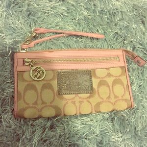 Pink and tan Coach Poppy wristlet