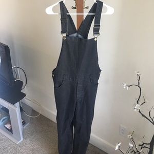 Black overalls with gold buttons
