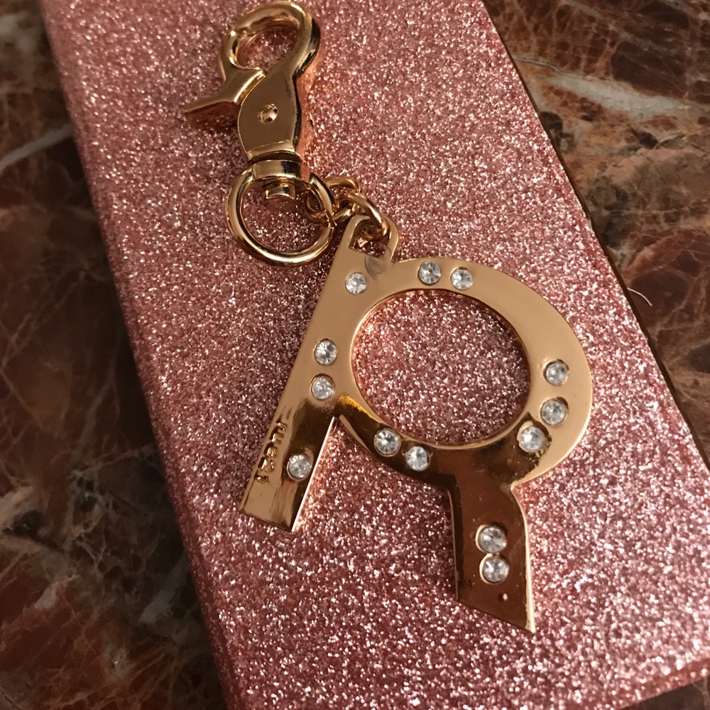 GOLD PLATED WITH CRYSTALS FORMING A "R"