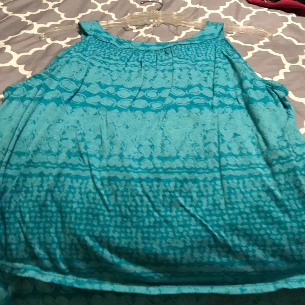 Blue sleeveless top with ruffles