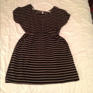 A little black dress with small khaki stripes.