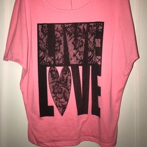 Pink shirt with “ live love” written on it!