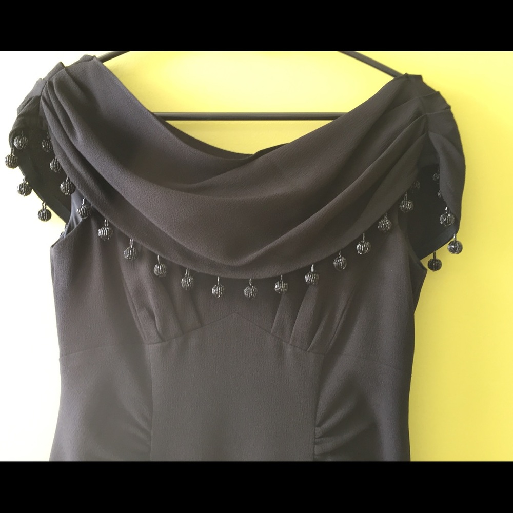 This is a Nanette Lepore size 2 black dress. - Picture 3 of 8
