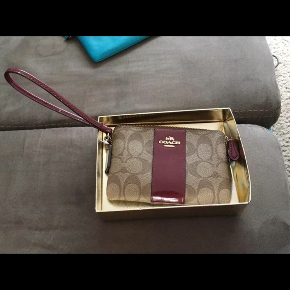 Red and brown coach wristlet