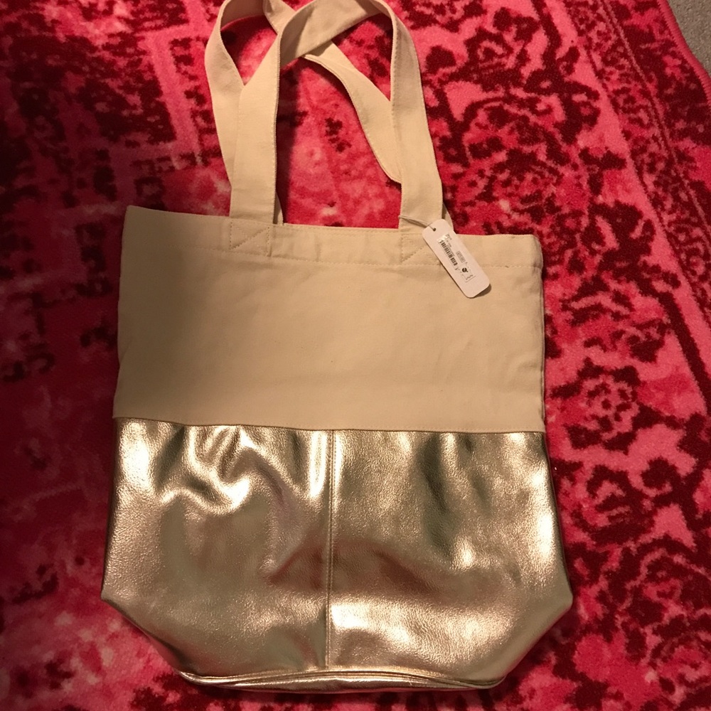 NWT Charming Charlie cream and gold tote bag