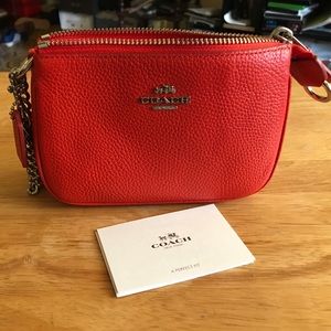 Coach orange wristlet