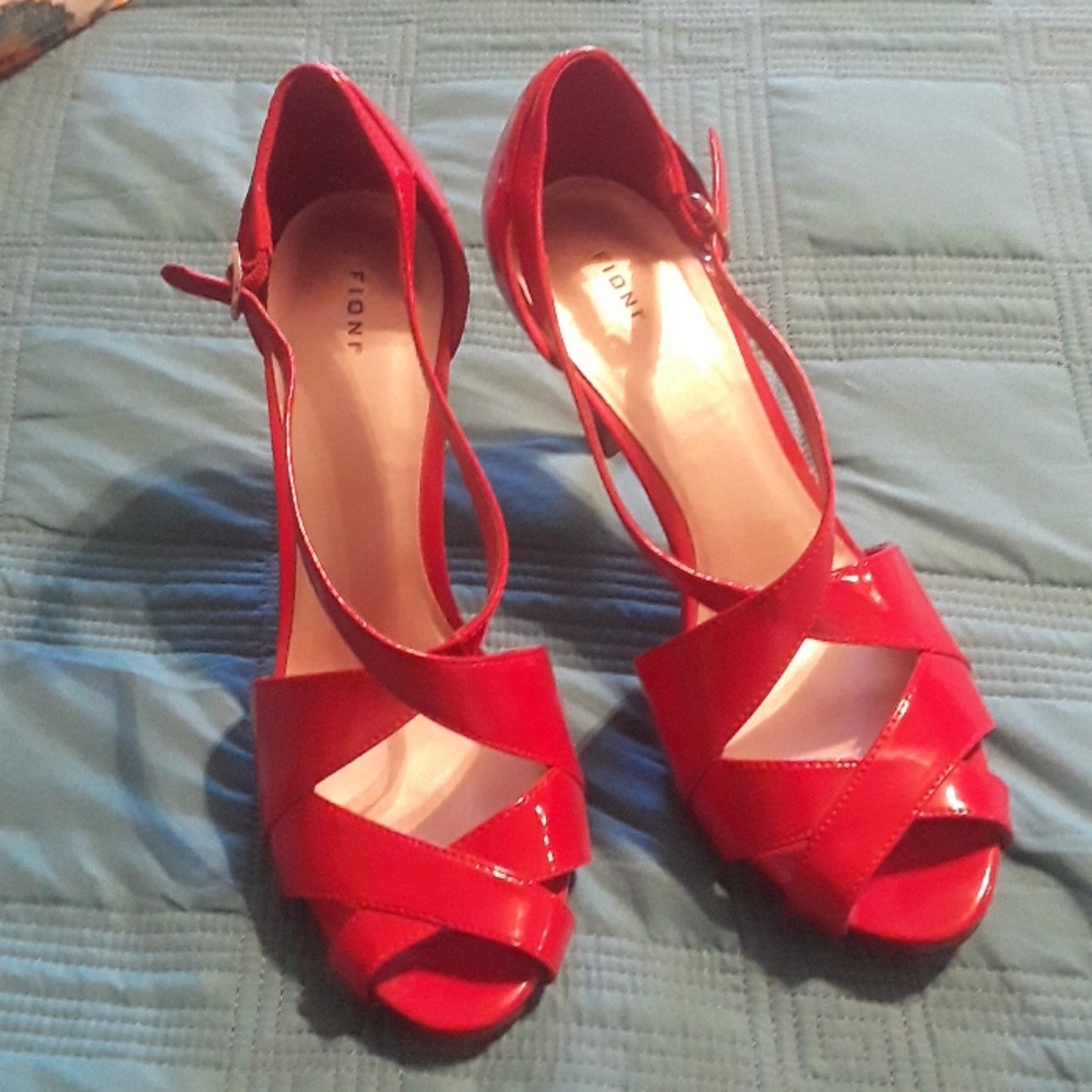 Red Pantent heals. Open toe size 9