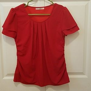 Red blouse with cinched sides