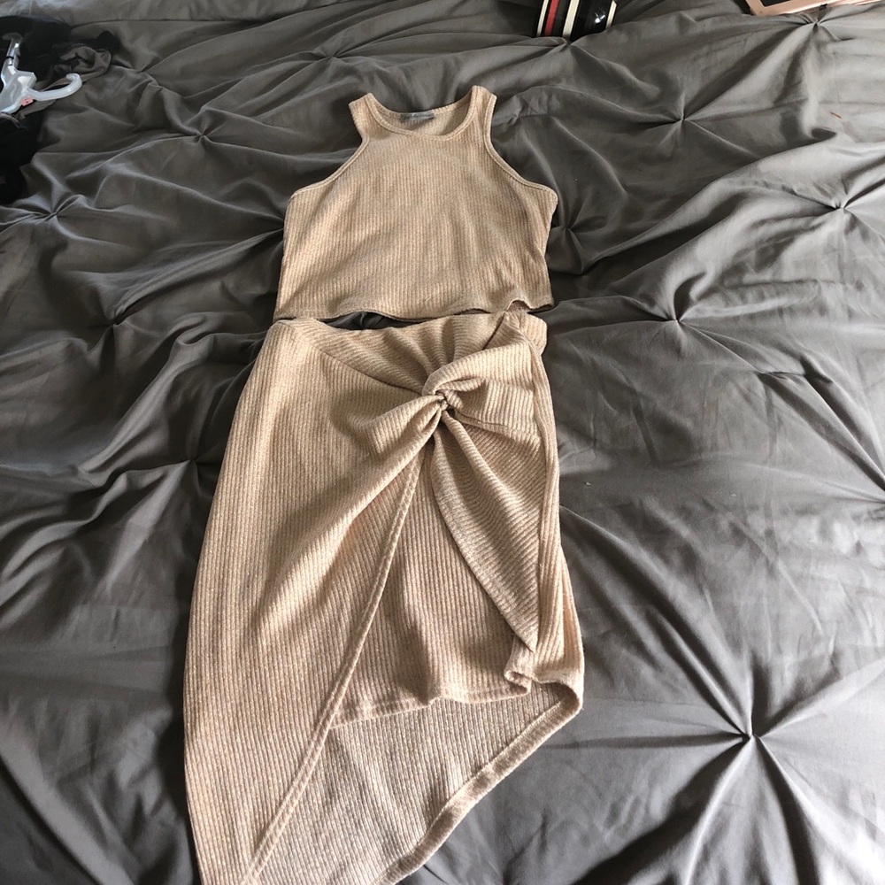 Gold crop top and asymetrial skirt  ensemble.