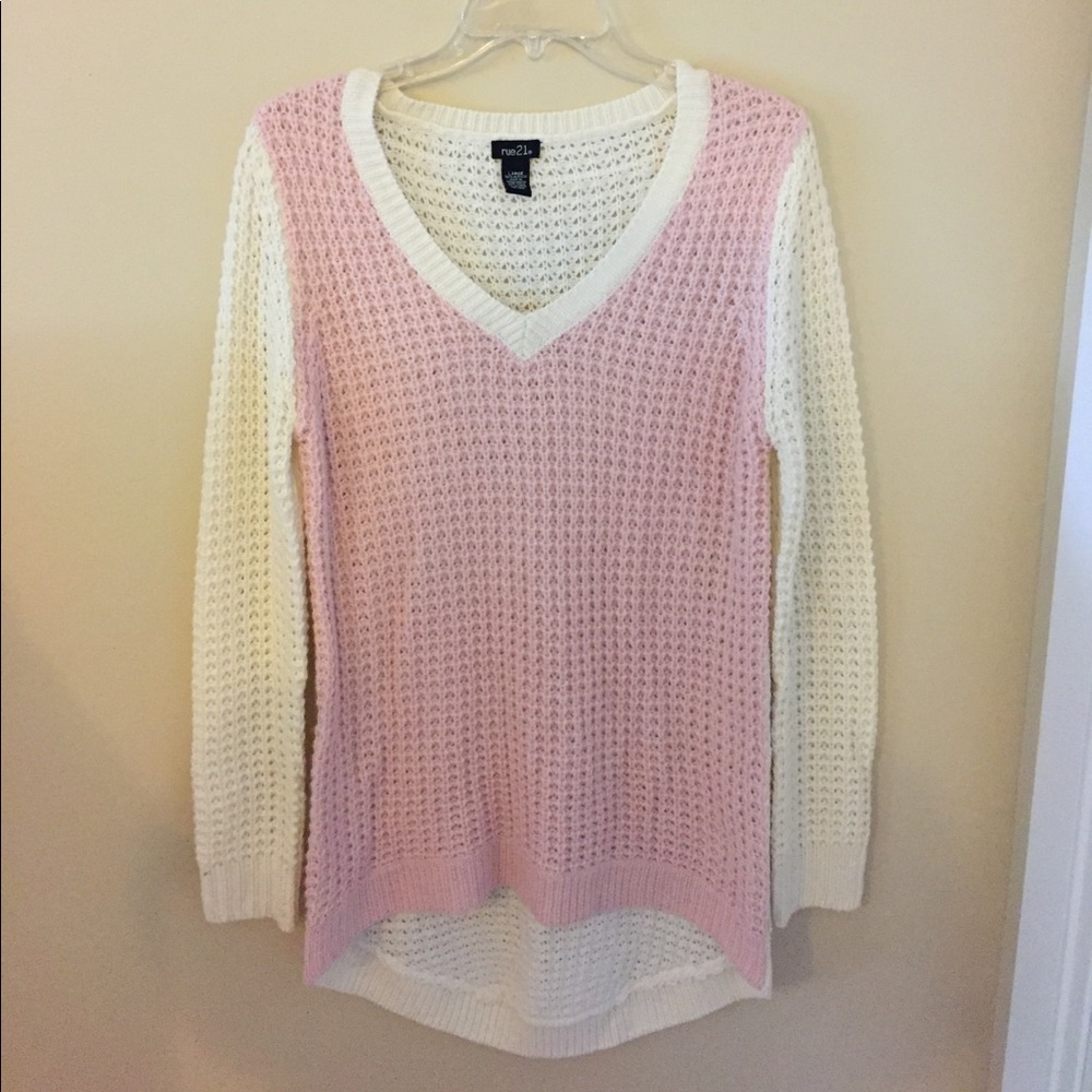 Pink and cream colored sweater