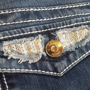 Vanity jean shorts with sequined pockets.
