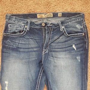 Mens Buckle blue jeans.